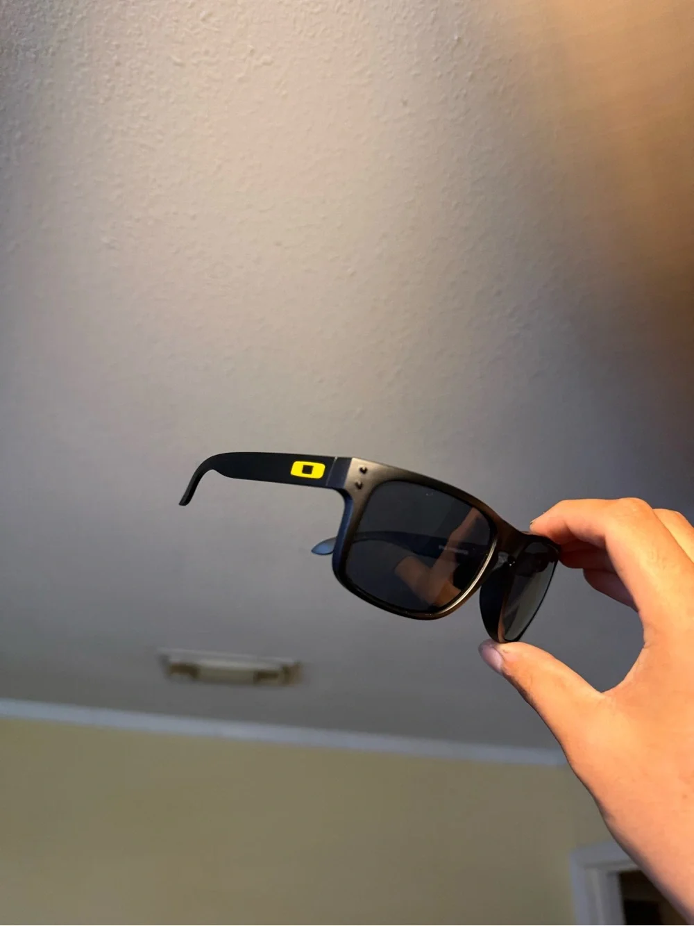 Oakley Matte Black Sunglasses with Yellow Logo Accent Oakleys